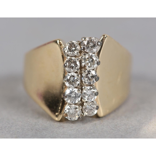 212 - A DIAMOND RING c.1970, the brilliant cut stones claw set in two off set rows flanked by broad convex... 