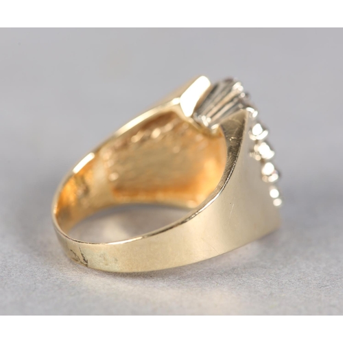 212 - A DIAMOND RING c.1970, the brilliant cut stones claw set in two off set rows flanked by broad convex... 