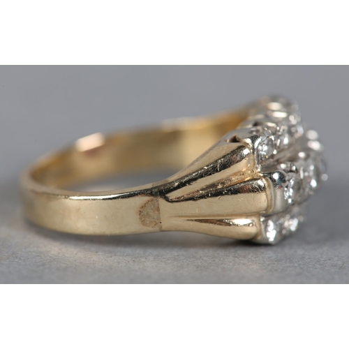 213 - A DIAMOND RING c1970, the brilliant cut stones set in three rows in line, in yellow and white metal ... 
