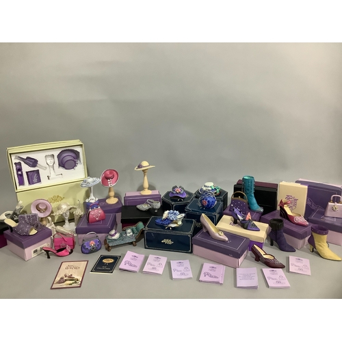 107 - A collection of resin shoes, hats and handbags mainly by Leonardo Collection boxed