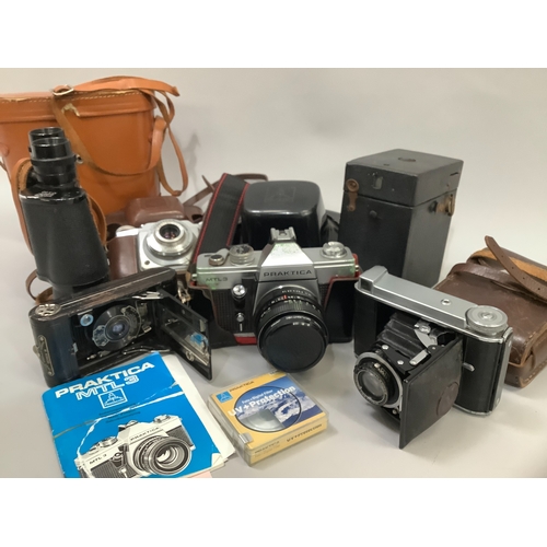 90 - A Voigtlander Bessa 66 camera in original leather case, a Praktica MTL3 SLR camera with original ins... 