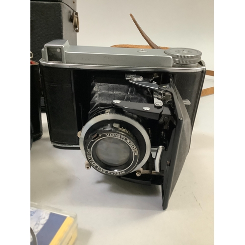 90 - A Voigtlander Bessa 66 camera in original leather case, a Praktica MTL3 SLR camera with original ins... 