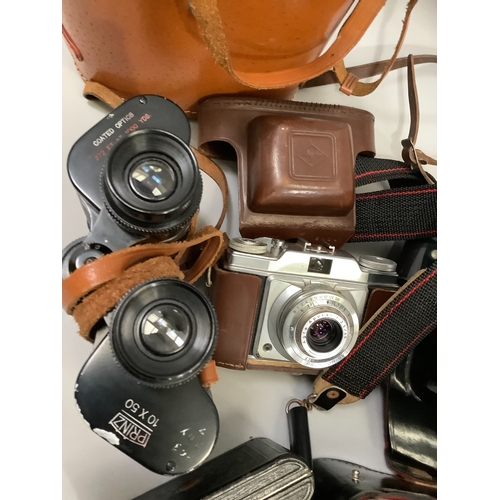 90 - A Voigtlander Bessa 66 camera in original leather case, a Praktica MTL3 SLR camera with original ins... 