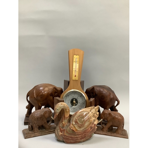 200 - A pair of hardwood elephant bookends, an agate swan, modern barometer and a smaller pair of elephant... 