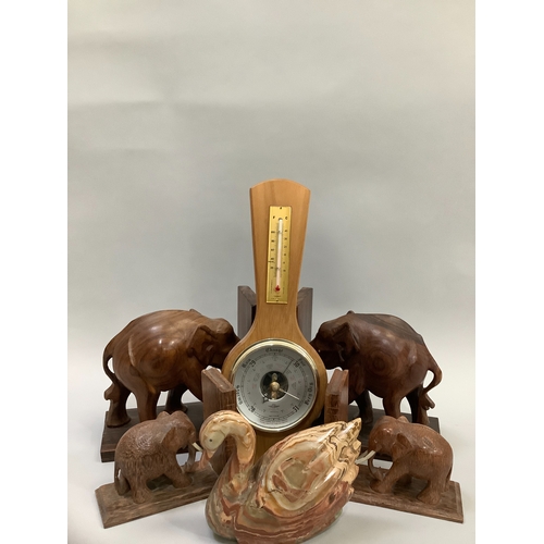 200 - A pair of hardwood elephant bookends, an agate swan, modern barometer and a smaller pair of elephant... 