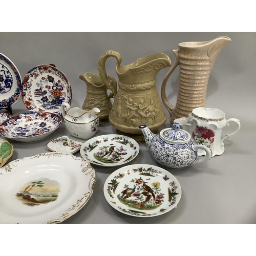 110 - A Spode china moulded and polychrome painted cream jug with scattered flowers and gilt rim line, pai... 