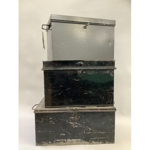 133 - A grey metal two handled deed box with key and two vintage black, tin deed boxes with side carrying ... 