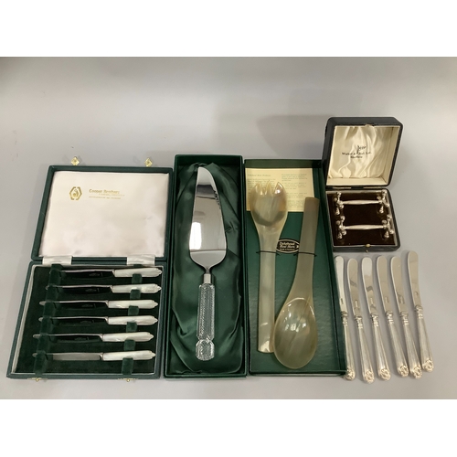 213 - A box set of Walker & Hall silver plated knife rests, a cased set of six mother-of-pearl handles tea... 