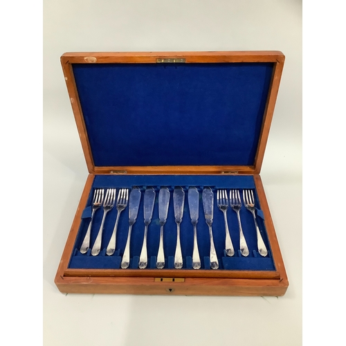 210 - A mahogany cased set of twelve silver plated fish knives and forks by Walker & Hall with leaf bud te... 