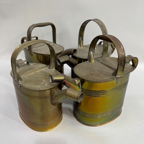 175 - Four Victorian brass hot water cans