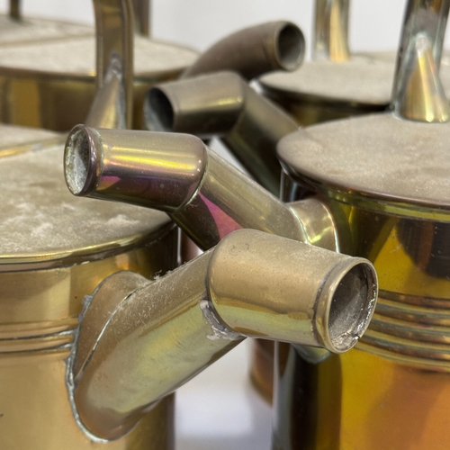 175 - Four Victorian brass hot water cans