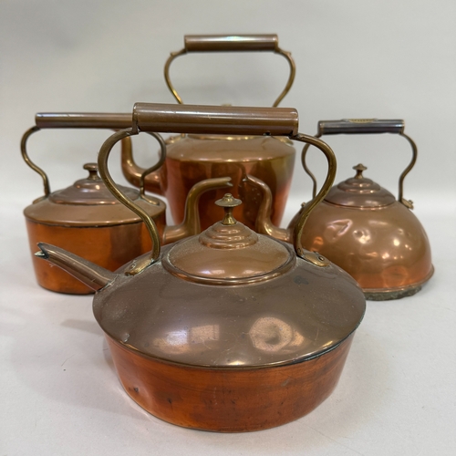 212 - Four various copper kettles of circular and oval outline one marked to the handle: 'Manley's Patent'... 