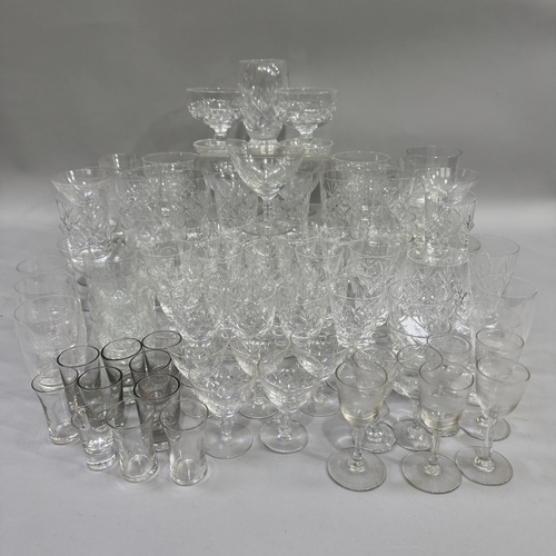 113 - A quantity of cut and etched table glass of  various designs including water glasses, ports, sherrie... 