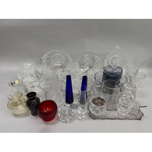 104 - Mixed cut and etched moulded glassware including vases, preserved pots, water jugs, fruit dishes, a ... 