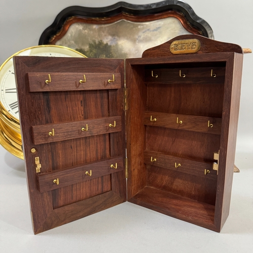 195 - A teak and brass mounted key cabinet, a miniature chest of three drawers and a pressed metal tray wi... 