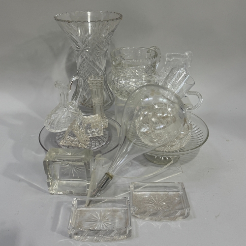 109 - Cut and moulded glassware including tall cut glass flower vase, water jug, cream jug, specimen vase,... 