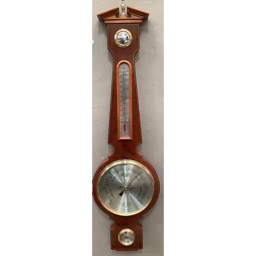 154 - A yew wood aneroid barometer by Committi, with hygrometer, 68cm long (as new, in original packaging)