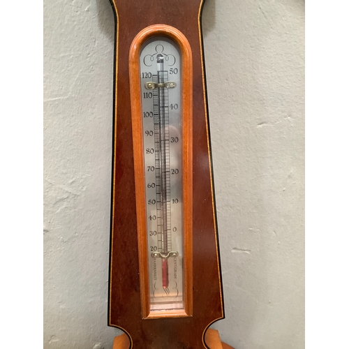 154 - A yew wood aneroid barometer by Committi, with hygrometer, 68cm long (as new, in original packaging)