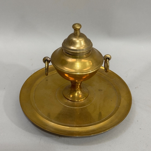 187 - A brass ink well of classical urn form with dome cover and ring handles on a circular dished base, 1... 