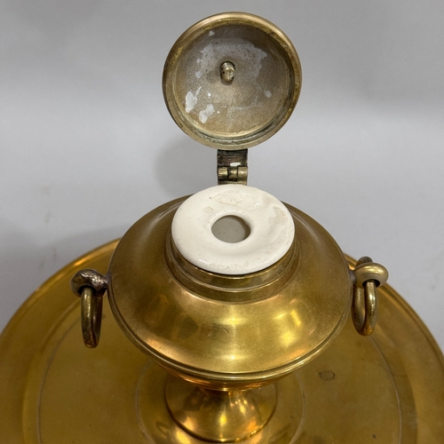 187 - A brass ink well of classical urn form with dome cover and ring handles on a circular dished base, 1... 