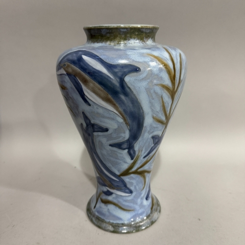 24 - Cobridge stoneware vase painted with dolphins designed by Phillip Gibson, impressed marks signed by ... 