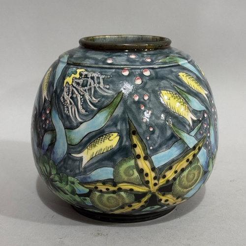 26 - A Cobridge stoneware vase of rounded form painted with fish, starfish, shells and grasses on a pale ... 