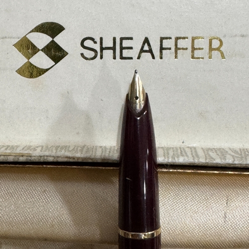 52 - A Sheaffer maroon and gilt fountain pen in original box