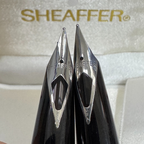 55 - A pair of Sheaffer brushed white metal fountain pens in a Sheaffer case