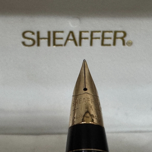 59 - A Sheaffer white metal fountain pen with 14k gold nib