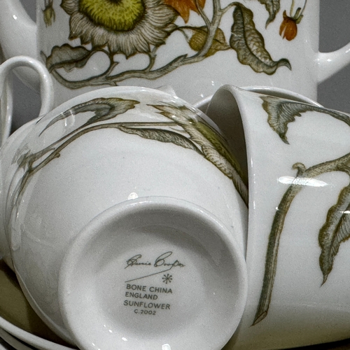 43 - A Susie Cooper china tea service of sunflower design comprising teapot, lidded sugar, milk jug, six ... 