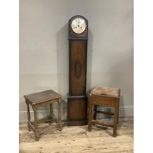 122 - An oak 1930s granddaughter clock together with a 1930s stool with lift up upholstered stool and a sm... 