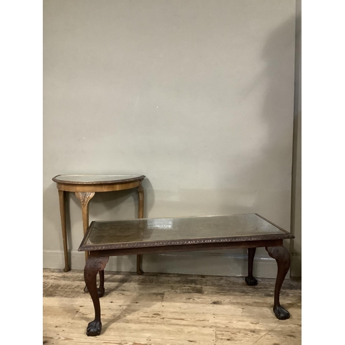 128 - A walnut coffee table on cabriole legs together with a walnut demi lune table