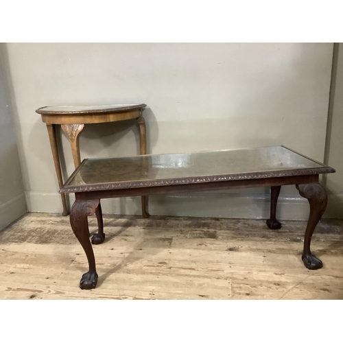 128 - A walnut coffee table on cabriole legs together with a walnut demi lune table