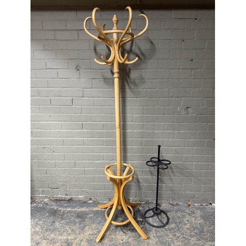 147 - A reproduction bentwood hat and coat stand together with a cast iron umbrella stand