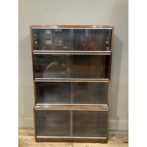 302 - A four section Minty bookcase with glazed sliding doors, 90cm wide