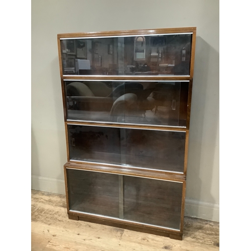 302 - A four section Minty bookcase with glazed sliding doors, 90cm wide