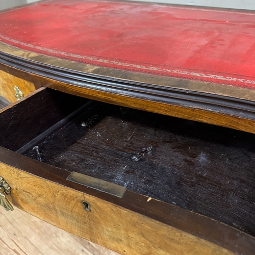 309 - A 1950s serpentine fronted walnut writing desk, two drawers , incised red leather writing surface, c... 