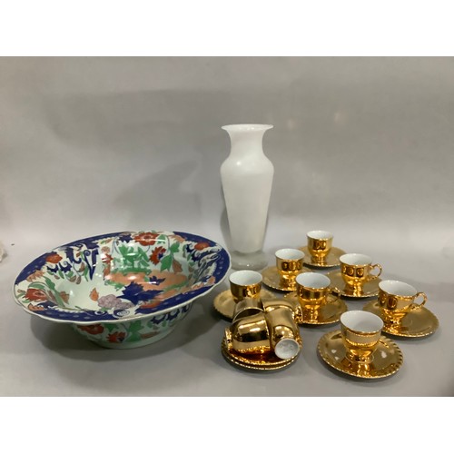 97 - A set of gilded china coffee cups and saucers, eleven cups and nine saucers together with a reproduc... 