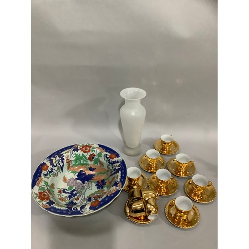 97 - A set of gilded china coffee cups and saucers, eleven cups and nine saucers together with a reproduc... 