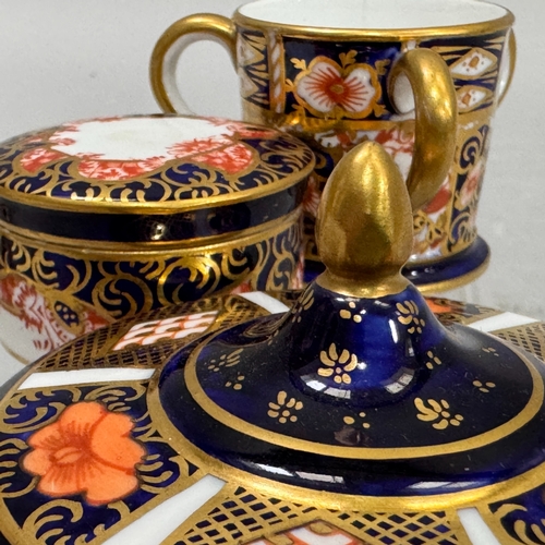 39 - A Royal Crown Derby lidded circular box 1920, a vase 1918 6cm high, a rouge pot 1907 and a tyg 1905 ... 