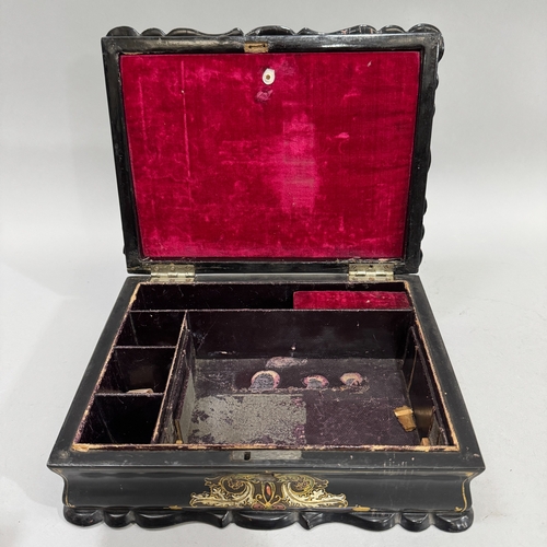 41 - A Victorian black paper-mâché lady's box inlaid with mother-of-pearl and gilt decoration, the interi... 