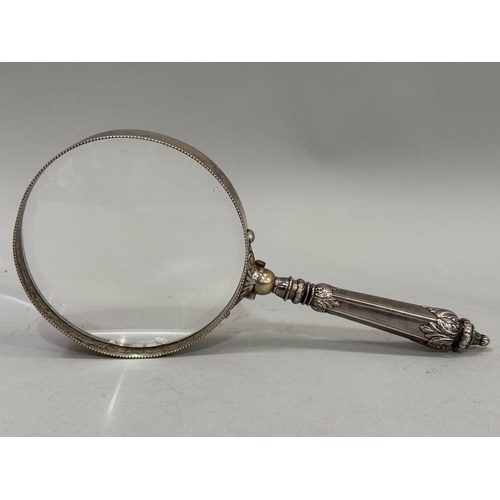 236 - A silver handled magnifying glass with a leaf capped handle, Birmingham circa 1893