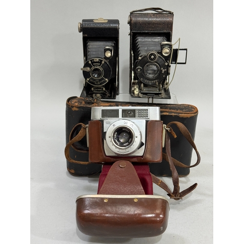 63 - A Zeiss Ikon Prontormat SLR camera in leather case together with a Coronet folding camera and a Voig... 