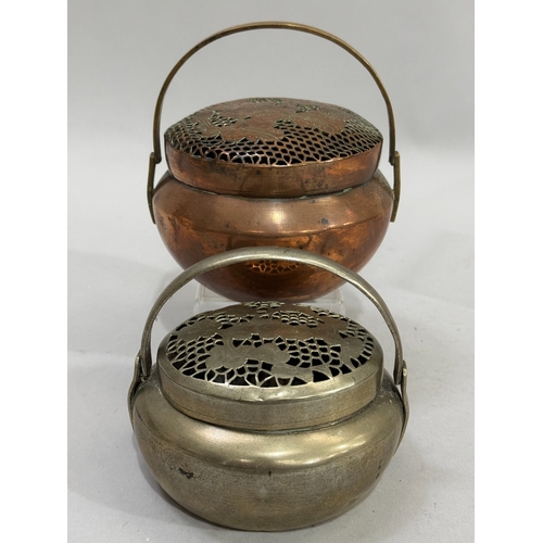 69 - An early 20th Century Chinese copper hand-warmer brazier with  swing handle, together with a paktong... 