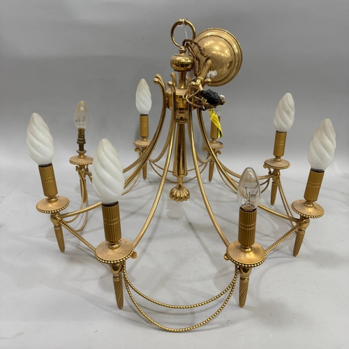 72 - A gilt metal eight light electrolier with beaded detail  and swags