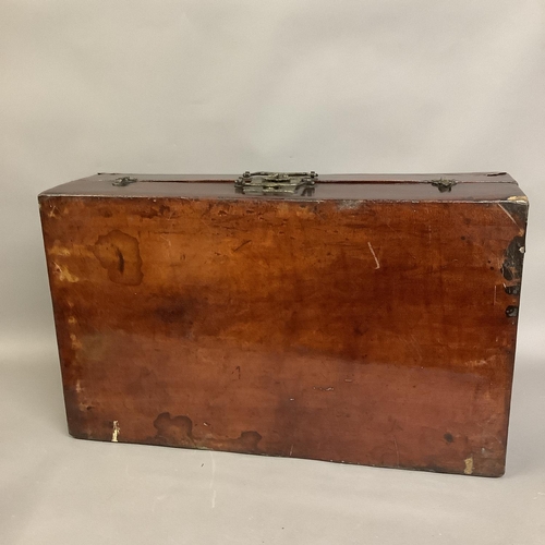 79 - A wooden leather-bound Chinese trunk with metal mounts, twin handles to front clasp, with label to i... 