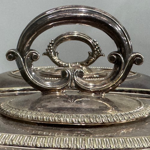 232 - A quantity of silver plated ware to include two oval entrée dishes and covers, sauce boat, serving d... 