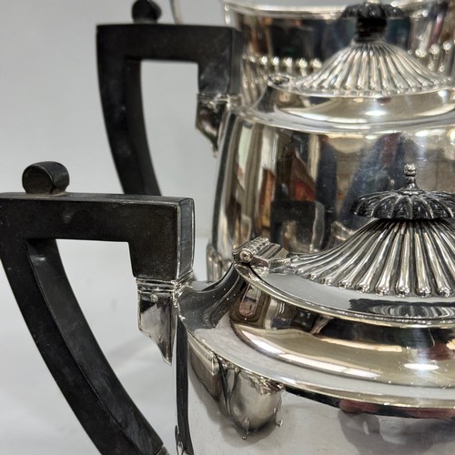 169 - A four piece silver plated tea and coffee service of half reeded design with ebonised handles and fi... 