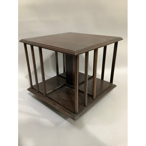 318 - An oak table top revolving bookcase