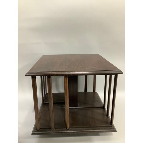 318 - An oak table top revolving bookcase